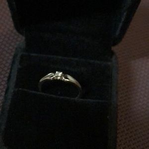 Promise ring with small diamond